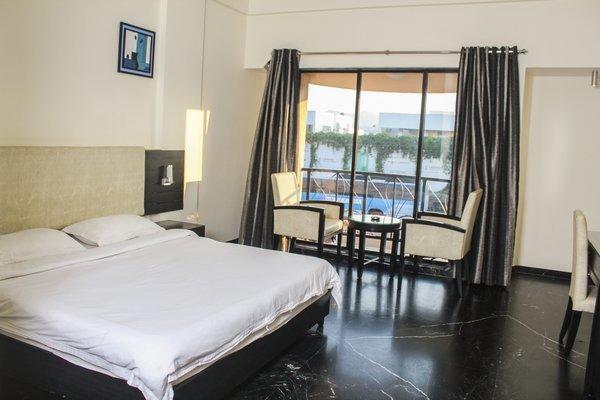 Hotel Aristro Lonavala Kamer foto